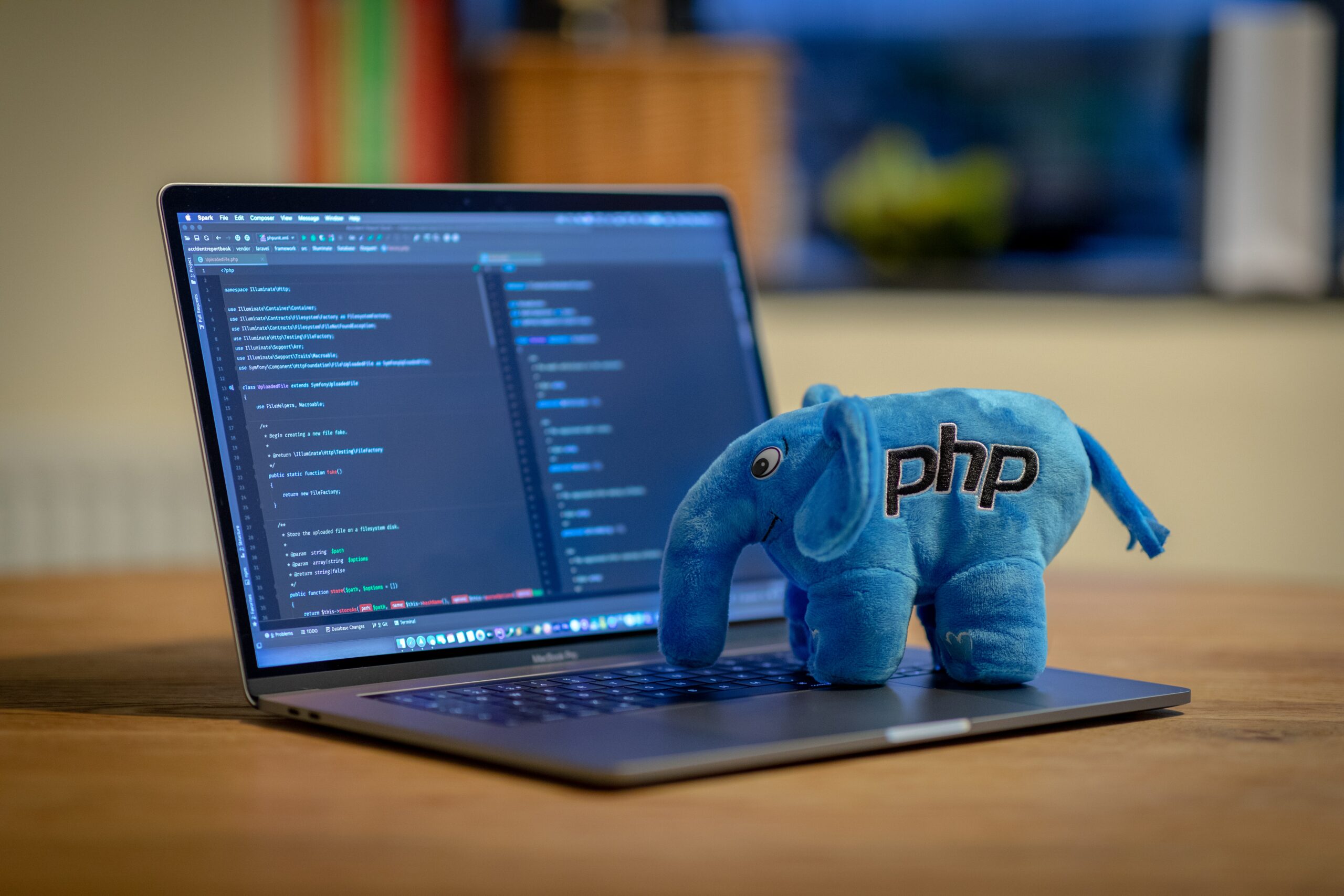 blue and white elephant plush toy on black laptop computer